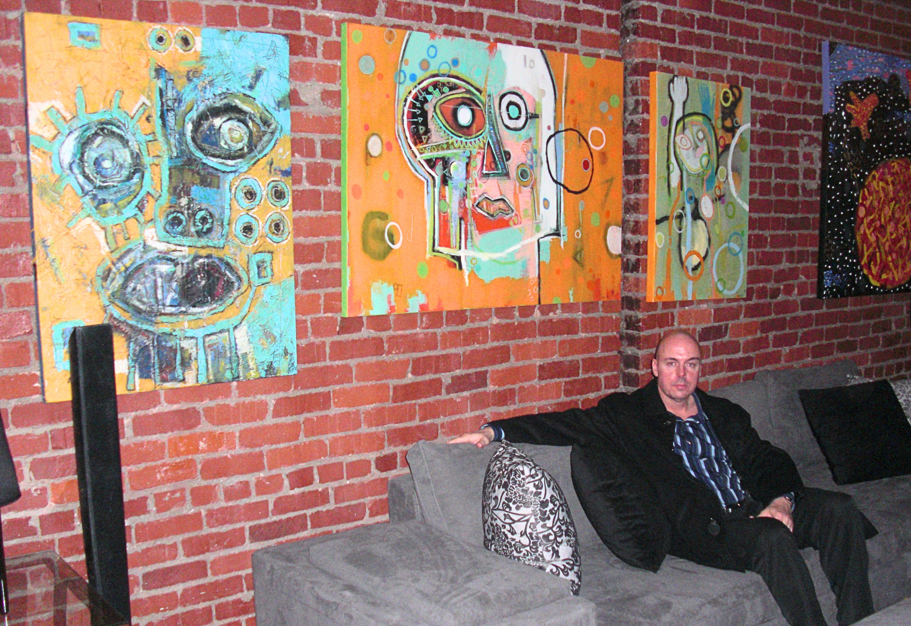 Urbana Modern Furniture Store Front featured artist, Deity, The Gaze, and Reach, downtown kansas city